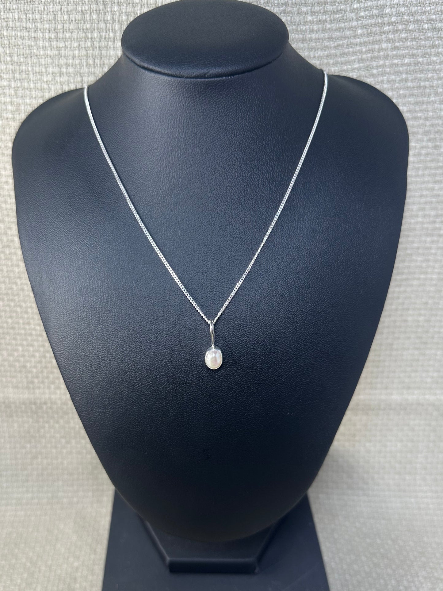 Fresh water pearl set in 925 sterling silver on a 925 sterling silver thin chain