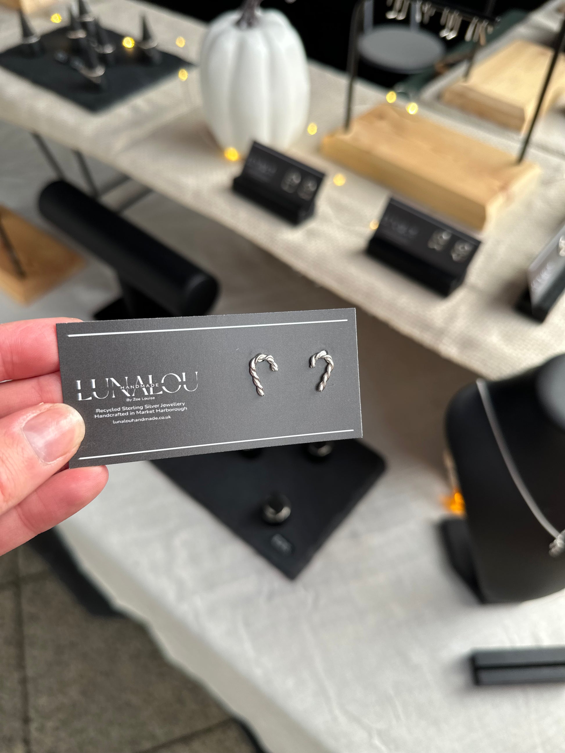 Twisted sterling silver earrings in the shape of a pair of candy canes, perfect for a Christmas gift or a special treat for yourself.