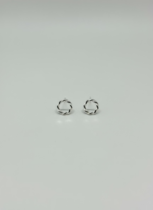 sterling silver earrings, round with a twisted ivy appearance. butterfly clasp