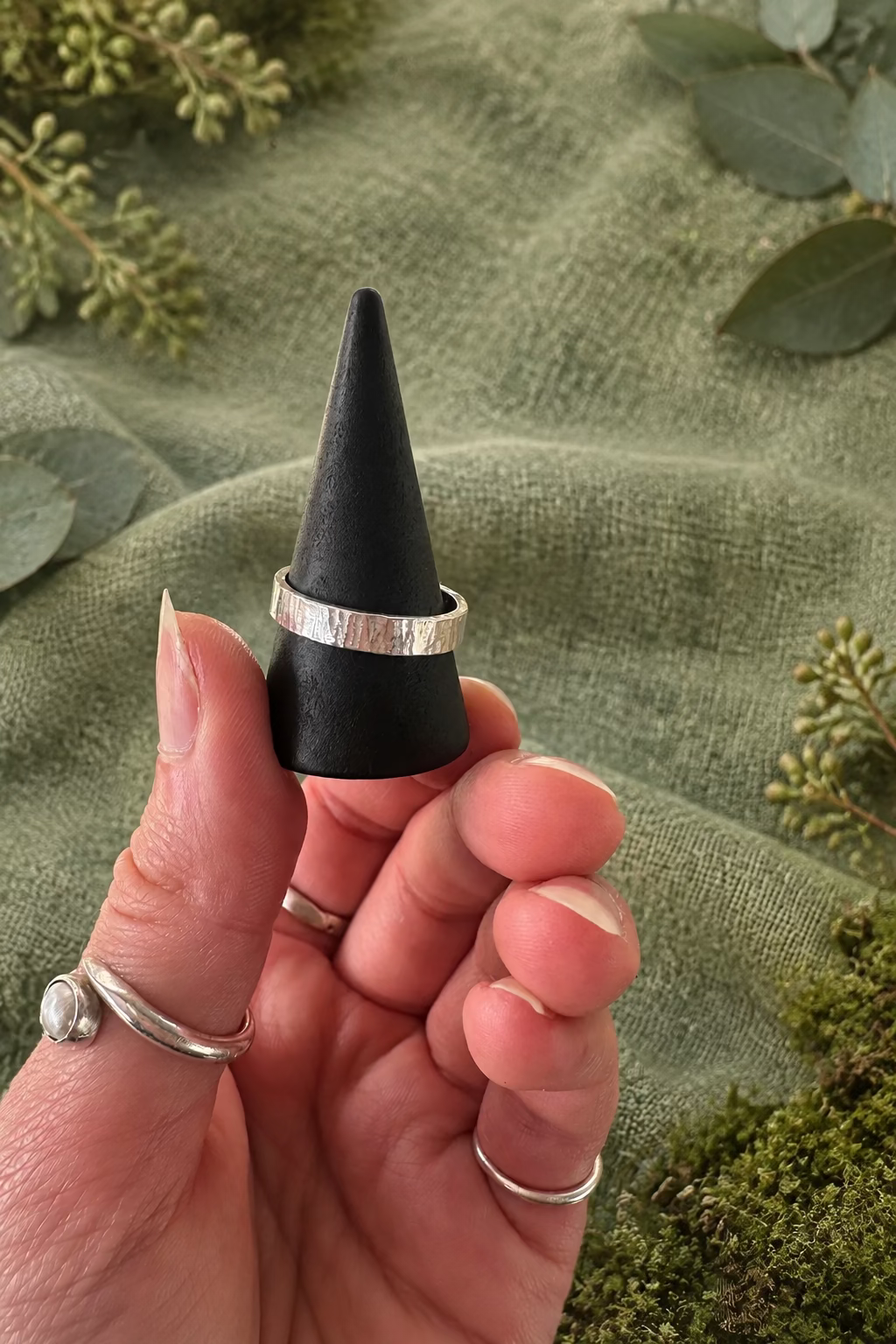     Close-up of handmade recycled 925 sterling silver Ripple Ring showing its unique textured surface