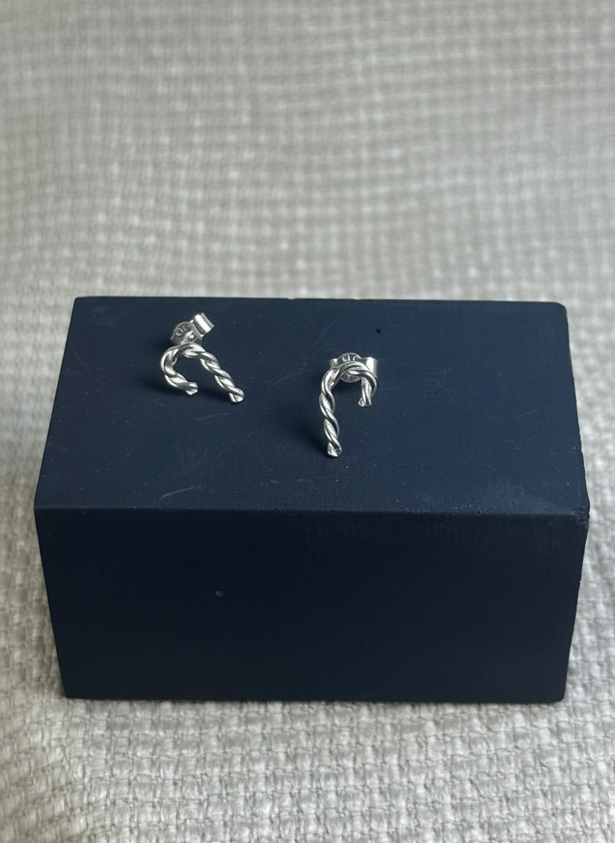 Twisted sterling silver earrings in the shape of a pair of candy canes, perfect for a Christmas gift or a special treat for yourself.